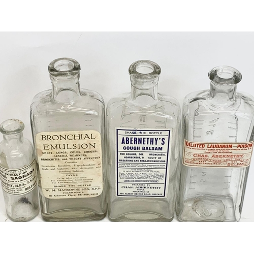 115 - 4 early 20th century bottles. 17cm.