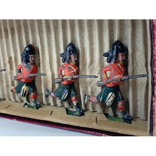 17 - An early 20th century Britains “British Soldiers” led models in original box. Manufactured by Willia... 