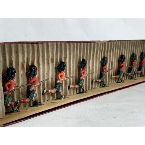 17 - An early 20th century Britains “British Soldiers” led models in original box. Manufactured by Willia... 