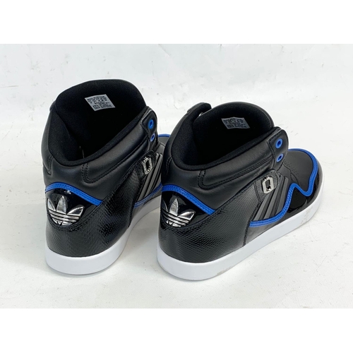 175 - A pair of Adidas shoes. UK 9.5