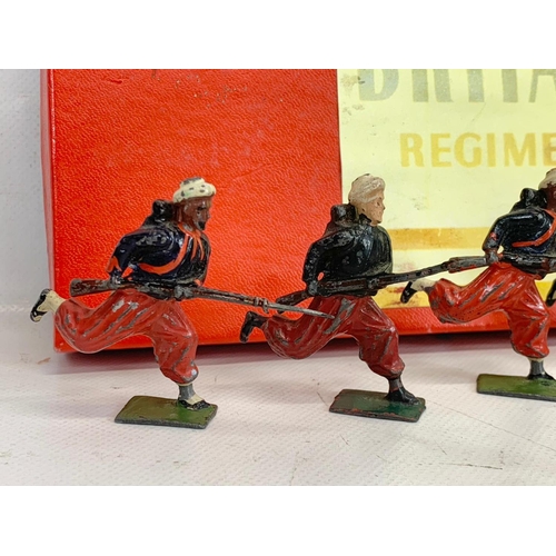 18 - Vintage Britains Soldiers Regiment Of All Nations led model soldiers in original box. Box measures 3... 