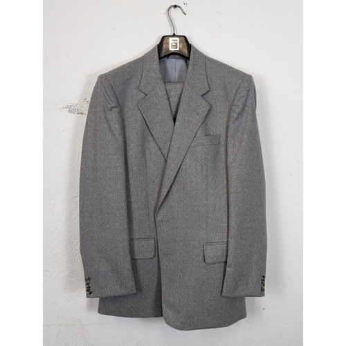 183 - A 2 piece Christian Dior suit, including blazer / jacket and trousers. Blazer is 38 Regular.