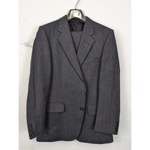 184 - A 2 piece Christian Dior suit, including blazer / jacket and trousers. Blazer is 38 Regular