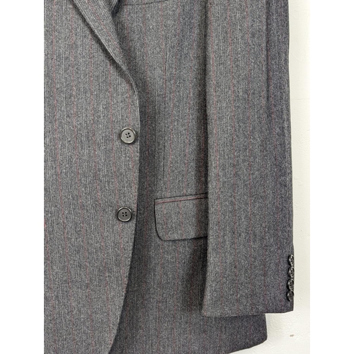 184 - A 2 piece Christian Dior suit, including blazer / jacket and trousers. Blazer is 38 Regular