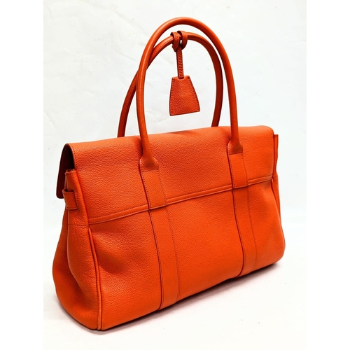 210 - A Mulberry classic bayswater handbag in tangerine orange. 40x7x42cm