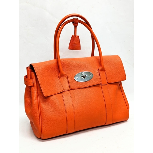 210 - A Mulberry classic bayswater handbag in tangerine orange. 40x7x42cm