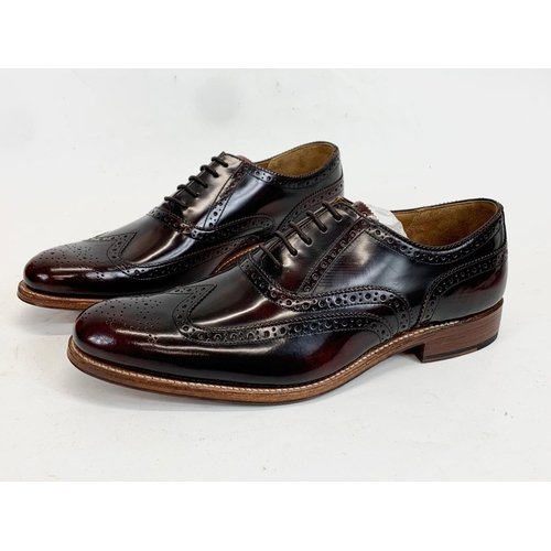 225 - A pair of Grenson leather dress shoes. UK 9.