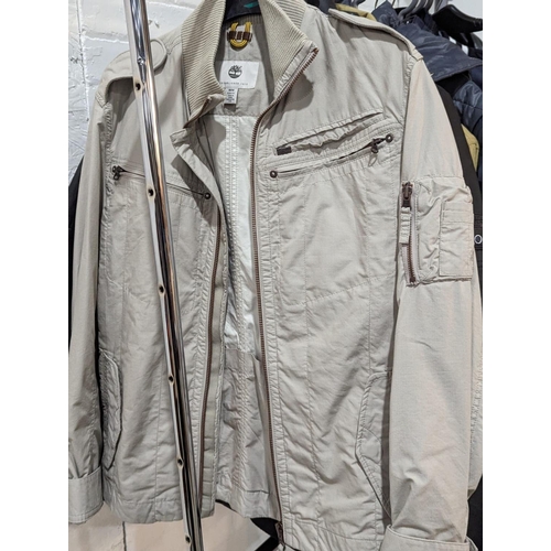 247 - A quantity of men's jackets and coats, including Timberland, TopMan, Dissident, etc.