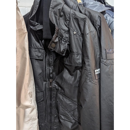 247 - A quantity of men's jackets and coats, including Timberland, TopMan, Dissident, etc.