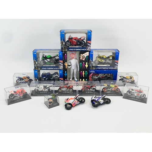 252A - A collection of model motorcycles in cases and boxes.