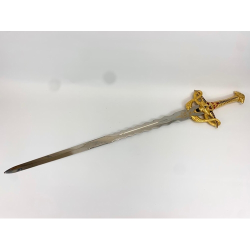 252F - A large decorative steel and brass sword. 119cm