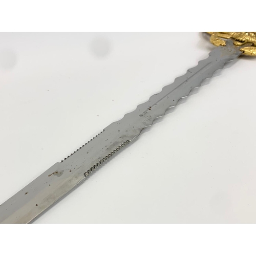 252F - A large decorative steel and brass sword. 119cm