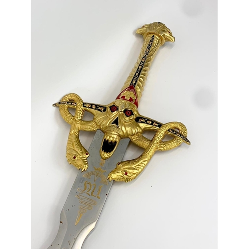 252F - A large decorative steel and brass sword. 119cm