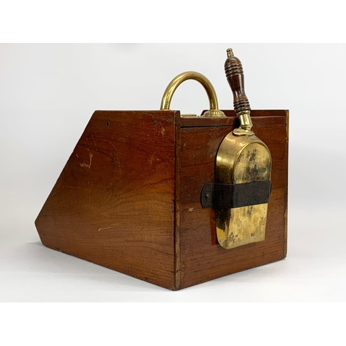 261 - A late Victorian oak and brass coal scuttle. 29 x 42 x 36cm