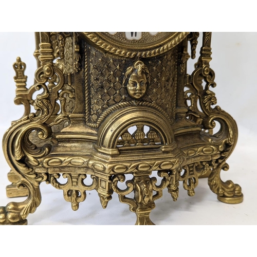 269 - An ornate brass 18th century French style mantle clock. 41.5cm