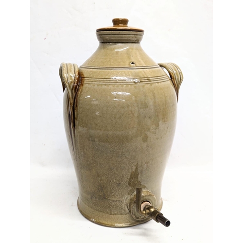 276 - A large early 20th century stone dispenser. 30x49cm