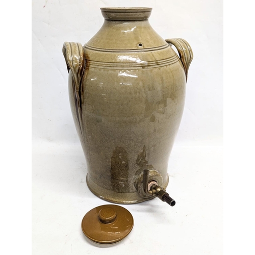 276 - A large early 20th century stone dispenser. 30x49cm