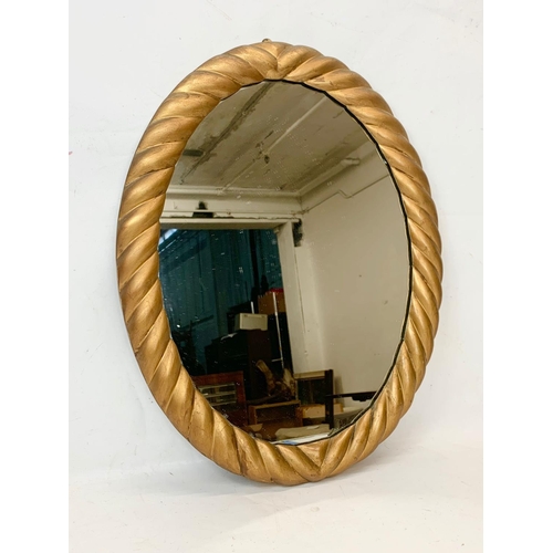 28 - A Victorian gilded rope twist frame mirror. 49 x 62cm