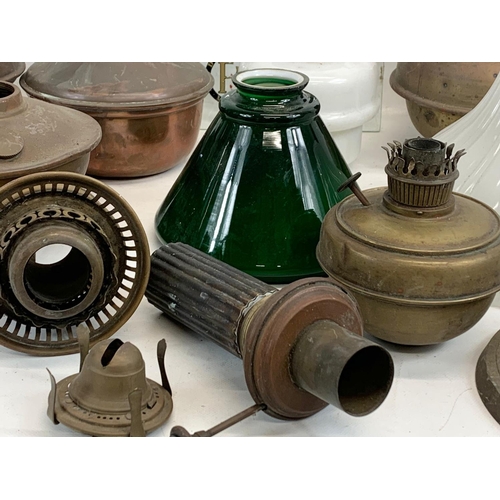 280 - A quantity of Victorian and early 20th century oil lamp parts and glass shades etc.