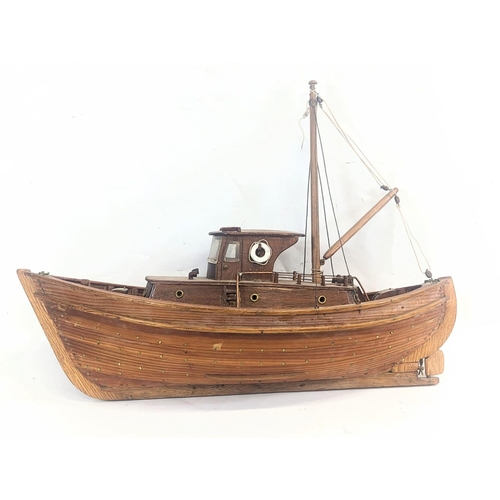 An early 20th century wooden model fishing boat. 57.5x40cm