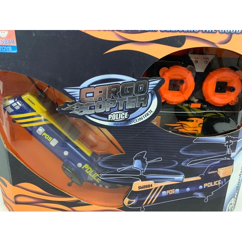 308 - A Danbar Toys remote control helicopter in box. Cargocopter Police. 38 x 28cm