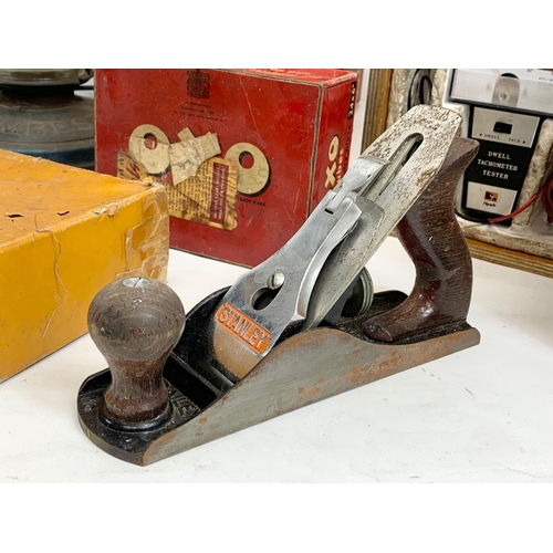 313 - A sundry lot. Including a Tempest Hurricane lamp 34cm, a Stanley planer, a Dwell Tachometer Tester, ... 