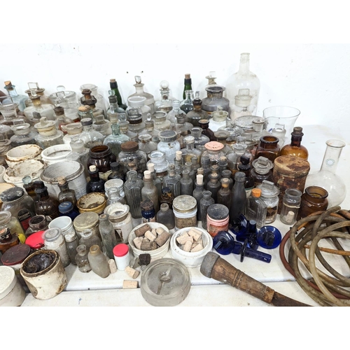 321 - A large quantity of early 20th century chemist bottles etc. Mostly damaged.