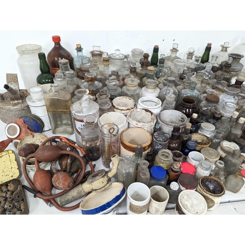 321 - A large quantity of early 20th century chemist bottles etc. Mostly damaged.