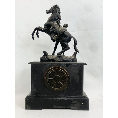 327 - A large Victorian slate mantle clock with spelter horse. 31 x 14.5 x 52cm.