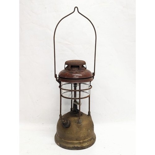 332 - A vintage Tilly lamp. 34cm