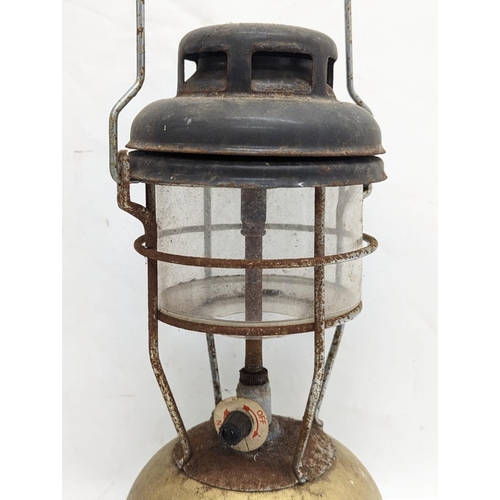 334 - A vintage Tilly lamp. 33cm