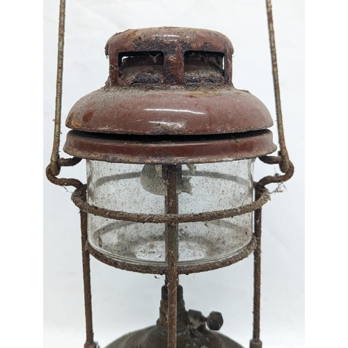 335 - A vintage Tilly lamp. 34cm