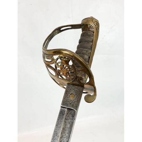 40 - A Victorian military officers sword, with officers initials “MH”. Stamped Henry Wilkinson Pall Mall ... 