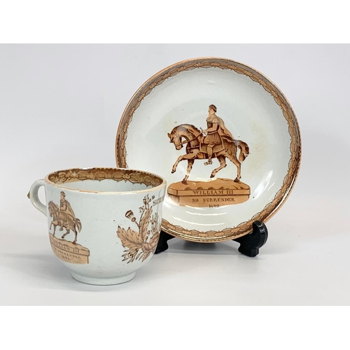 464 - A Victorian William III Commemorative tea cup and saucer. 10.5 x 7cm