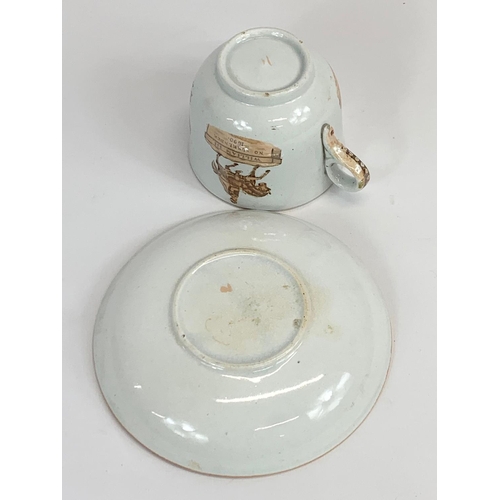 464 - A Victorian William III Commemorative tea cup and saucer. 10.5 x 7cm