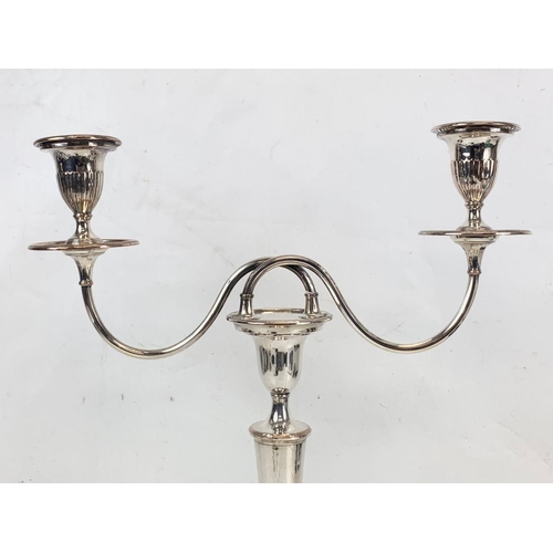 474 - A pair of large Edwardian silver plated candelabras. 35 x 42cm