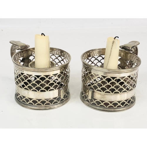 476 - A pair of late Victorian silver plated candleholders, H.E & Co. 13 x 7cm.