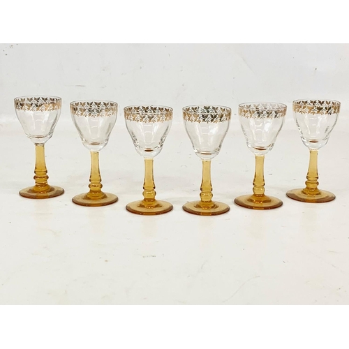 490 - A set of 6 vintage gilt crystal and amber drinking glasses. 9cm