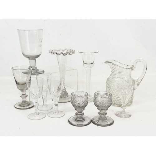 491 - A quantity of early to late 19th century glassware. Including a Georgian twist flute candleholder 16... 