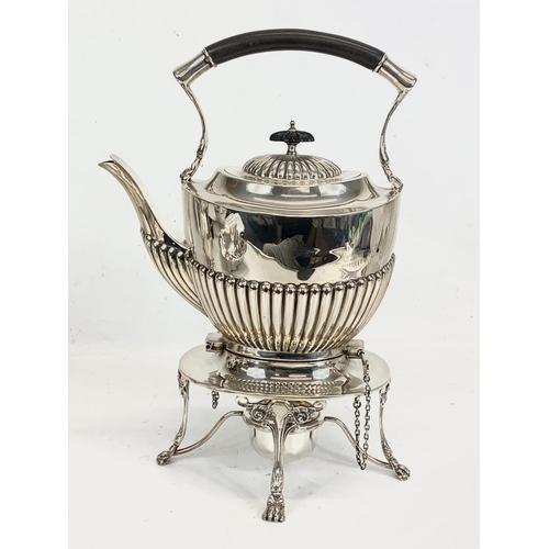 496 - A sterling silver spirit kettle. Birmingham 1907. 1075 grams. 32cm