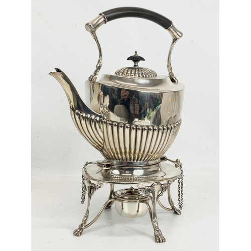 496 - A sterling silver spirit kettle. Birmingham 1907. 1075 grams. 32cm