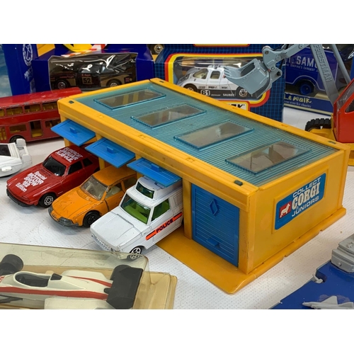 5 - A collection of model cars and toys etc. Including a Dinky Silver Jubilee Taxi in box, a Corgi Junio... 