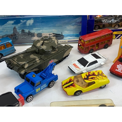 5 - A collection of model cars and toys etc. Including a Dinky Silver Jubilee Taxi in box, a Corgi Junio... 