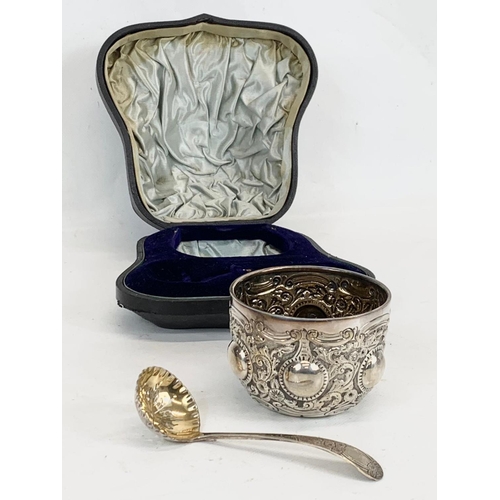 502 - A Victorian silver ornate bowl with sieve spoon in case. London 1892. 117 grams.