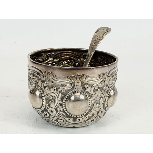 502 - A Victorian silver ornate bowl with sieve spoon in case. London 1892. 117 grams.