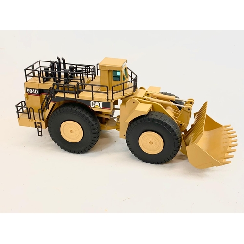 54 - A Caterpillar CAT 994D Wheel Loader model in box. Model measures 33 x 14cm. Box measures 37.5 x 13.5... 