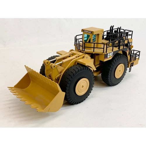 54 - A Caterpillar CAT 994D Wheel Loader model in box. Model measures 33 x 14cm. Box measures 37.5 x 13.5... 