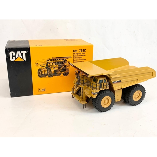 55 - A Caterpillar CAT 793C Off-Highway Truck model in box. 1:50. Model measures 27 x 15 x 13cm. Box meas... 