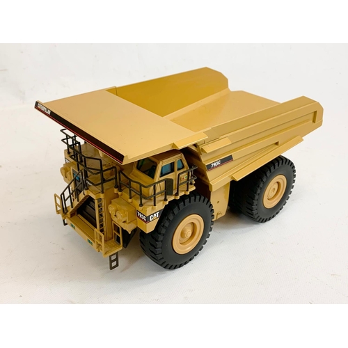 55 - A Caterpillar CAT 793C Off-Highway Truck model in box. 1:50. Model measures 27 x 15 x 13cm. Box meas... 