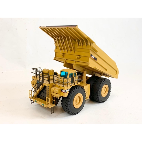 55 - A Caterpillar CAT 793C Off-Highway Truck model in box. 1:50. Model measures 27 x 15 x 13cm. Box meas... 